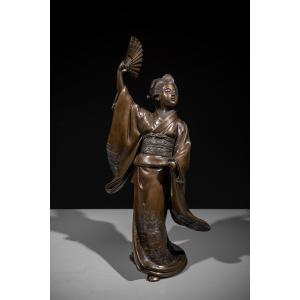 A Bronze Okimono Of A Dancer With A Fan