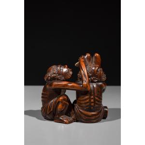 A Boxwood Shunga Okimono Depicting Ashinaga And Tenaga