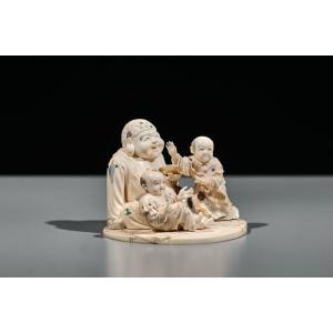 An Ivory And Shibayama Okimono Of Hotei With Karako Signed Gyokuzan