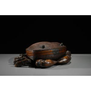 A Woven Bamboo And Wood Box In The Shape Of A Crab