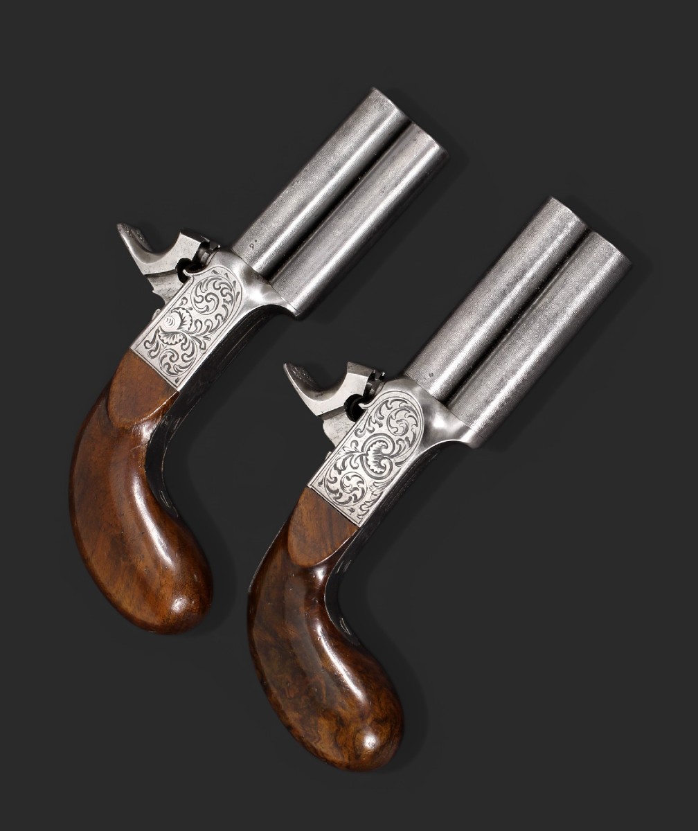 Paire de pistolets à percussion à double canon et damasquinés, vers 1850.