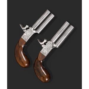 Paire de pistolets à percussion à double canon et damasquinés, vers 1850.