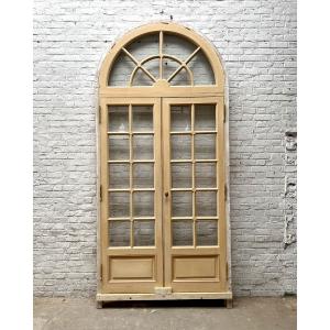 Double Glass Door With Its Rounded Transom And Frame