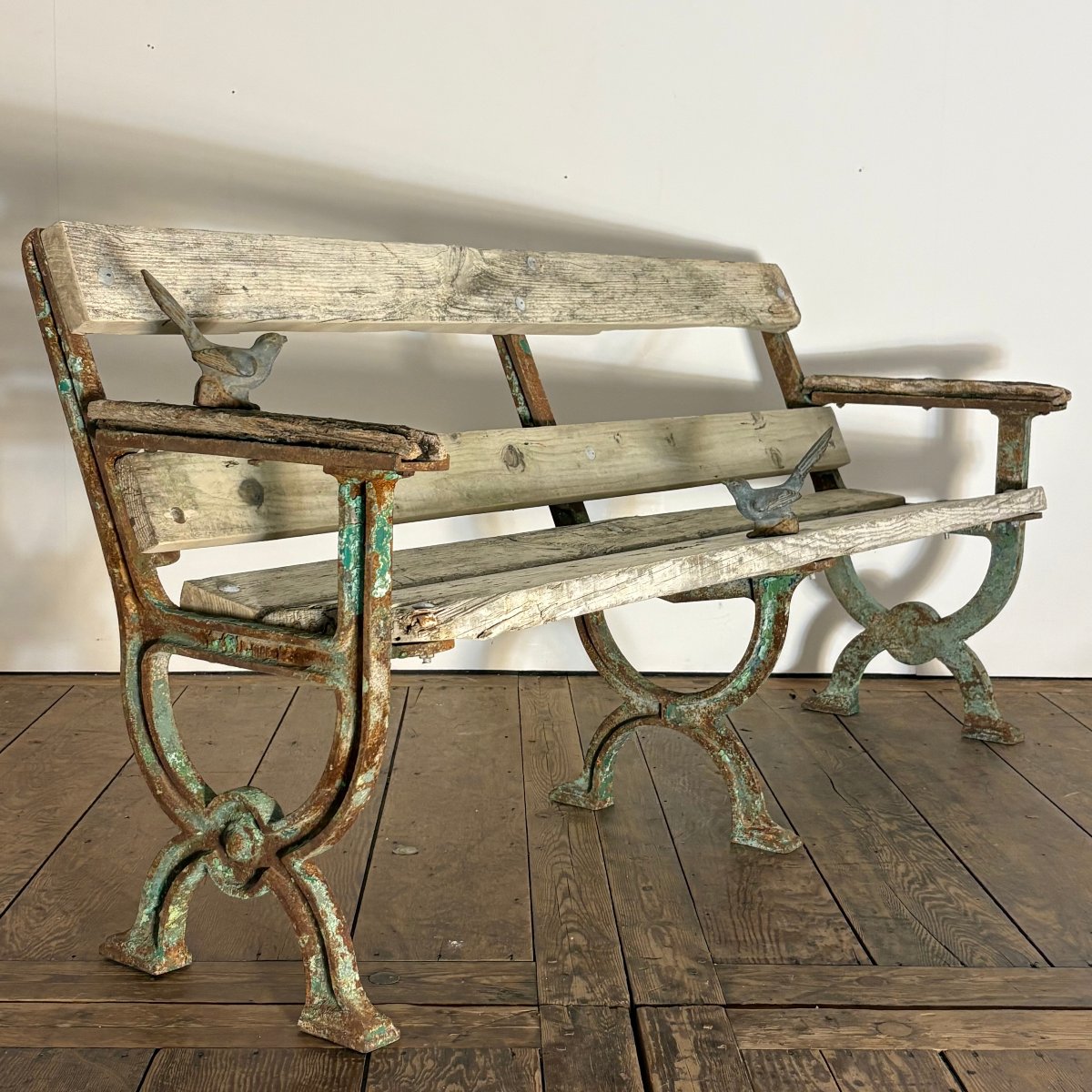 Banc de jardin en fonte  à pieds curule XIXe