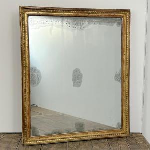 Grand miroir de boiserie d'époque Louis XVI