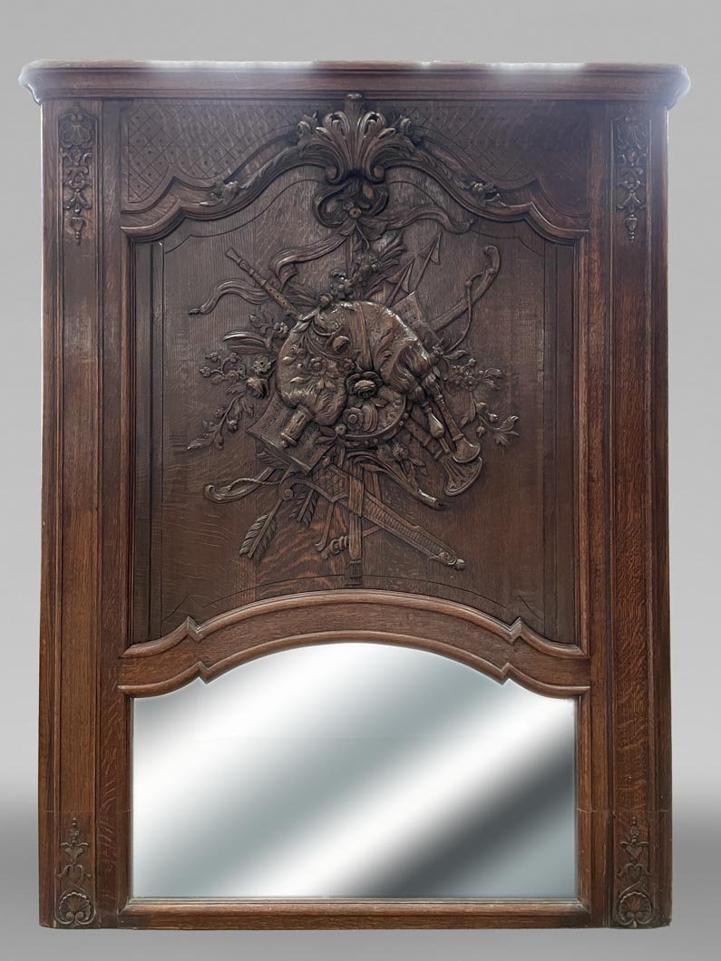 Trumeau en bois sculpté à décor de cornemuse