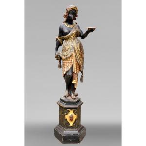 Nubienne porte-torchère en bois polychrome sculpté et doré