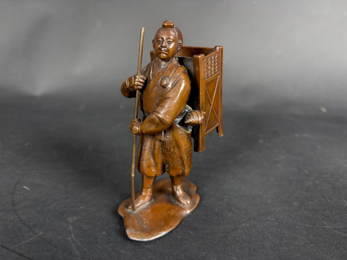 Japanese Bronze Okimono — A Pilgrim Traveler With A Conch Shell