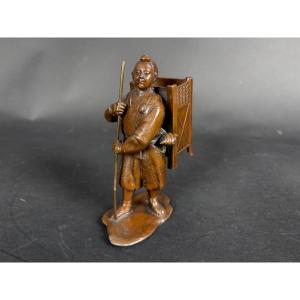 Japanese Bronze Okimono — A Pilgrim Traveler With A Conch Shell