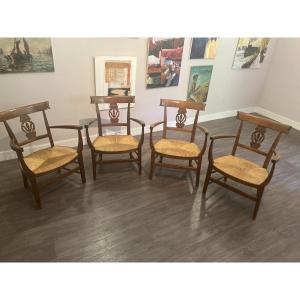 Suite de quatre fauteuils de style Directoire en merisier massif – France, vers 1950