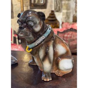 Porte-parapluie en céramique vernissée figurant un chien assis.