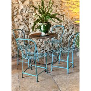 Quatre chaises et guéridon de jardin en fer riveté – début XXe siècle
