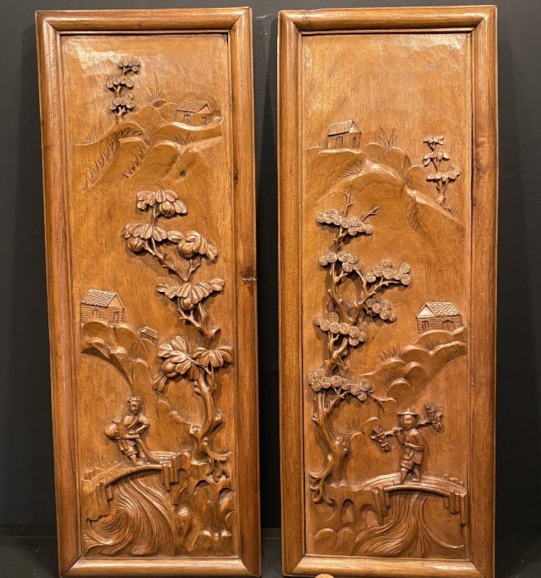 A Pair Of Carved Wooden Panels,