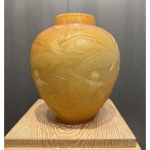 An Archer Vase By R. Lalique In Orange Glass.
