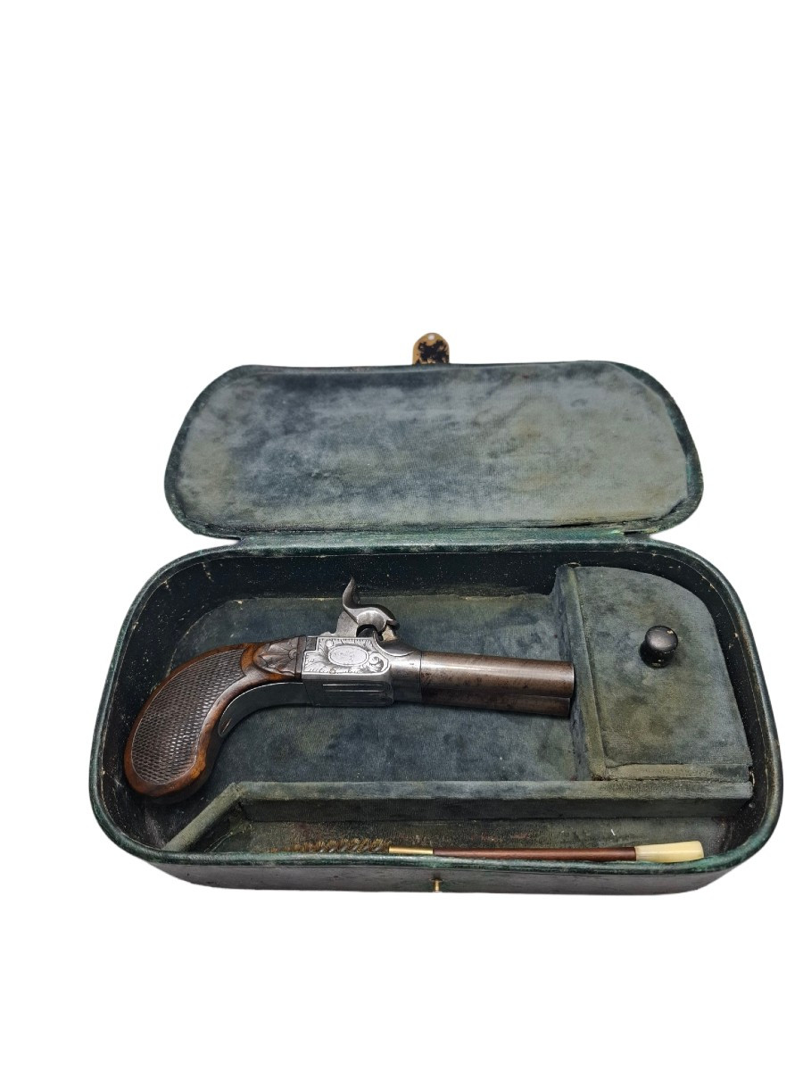 Double-barreled Pistol In A Box