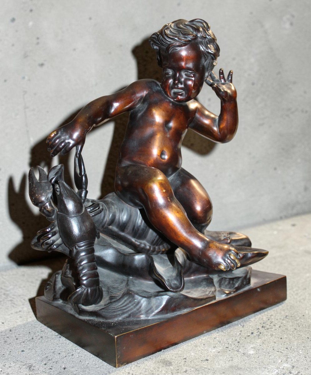 BRONZE D'APRES PIGALLE "ENFANT SURPRIS PAR LE PINCEMENT D'UNE èCREVISSE", FINE XIX SIECLE.