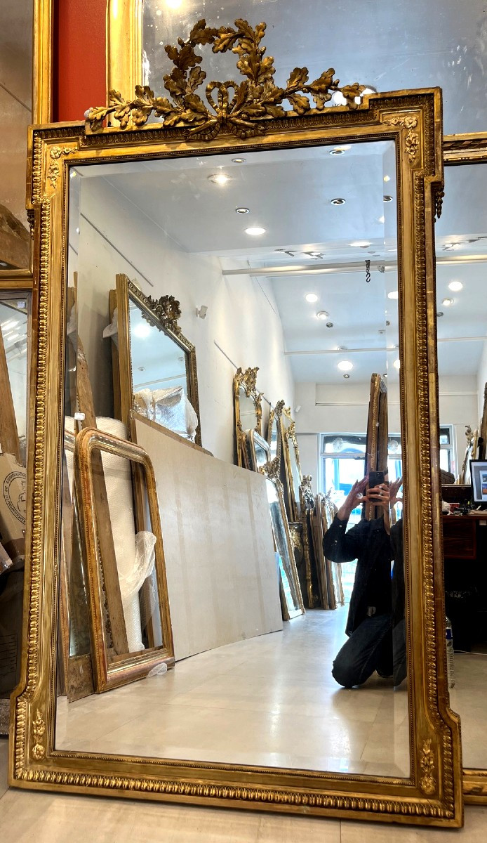 Miroir Louis XVI decors lauriers 102cm par 174cm 