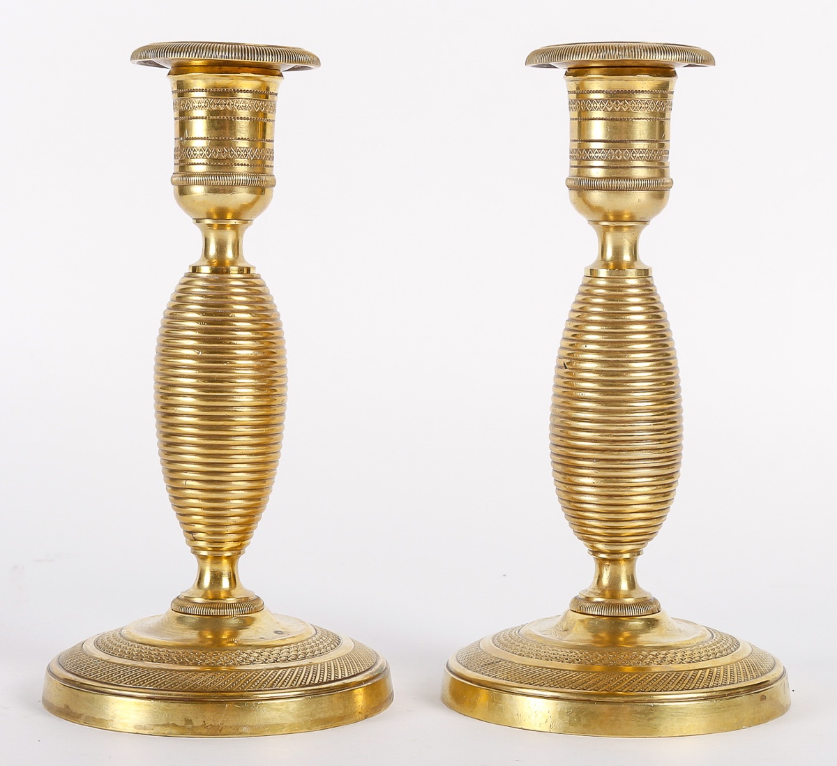 Pair Of Small Empire-era "ragot" Candlesticks In Chiseled And Gilt Bronze, C. 1805-1815