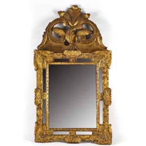 Miroir en bois sculpté à patine doré d’époque Régence vers 1715-1723
