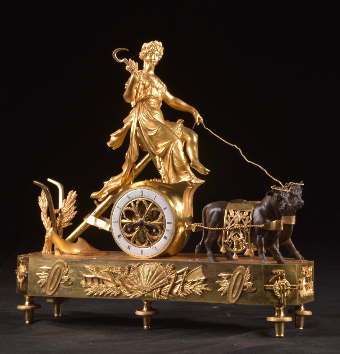 Pendule de cheminée Louis XVI "Le char de Cérès", en bronze doré et patiné