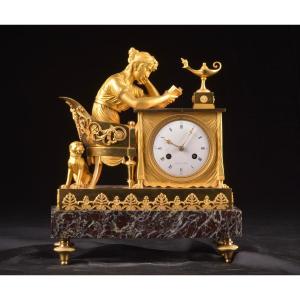La Lectura, A French Empire Mantel Clock In Patinated And Gilded Bronze, Ca. 1800