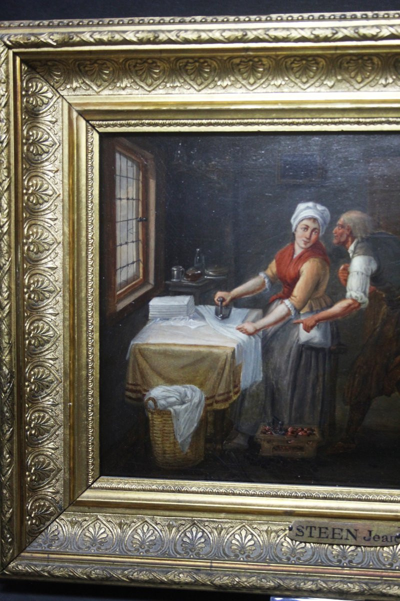 École flamande, Intérieur avec une femme repassant-photo-1