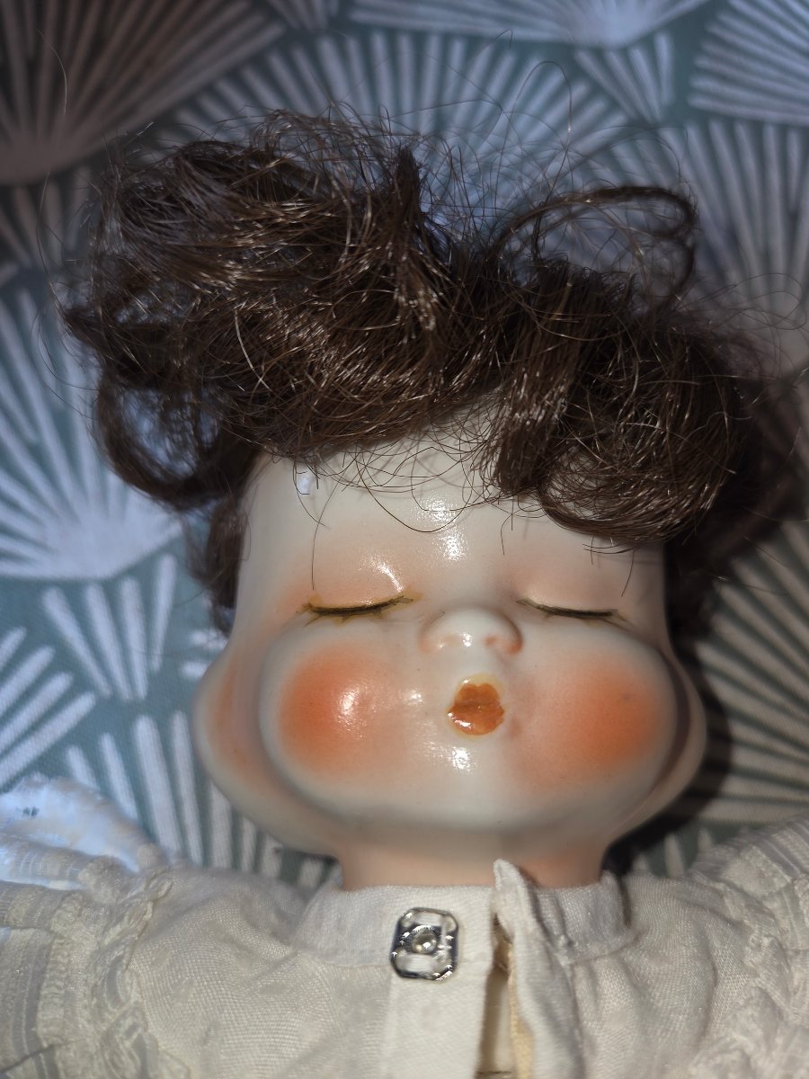 Poupée en porcelaine  tournante  a  4 visages des années 50-photo-1