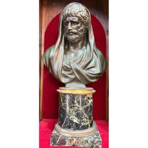 Bust In Bronze In The Antic Style. A Noble Man, A Veil On His Head.