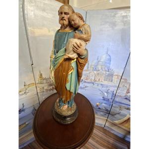 Statue Joseph et l'Enfant Jésus en plâtre peint Polychrome .