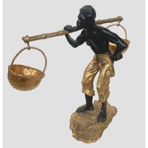 Bronze Group With Double Patina "man With Basket Pendulum" 20th Century
