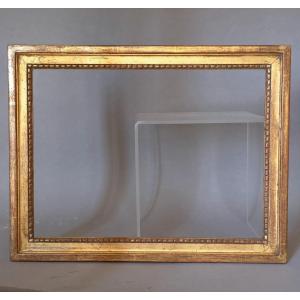 Cadre doré feuille Xxe de style Louis XVI feuillure : 34 x 25,5 cm