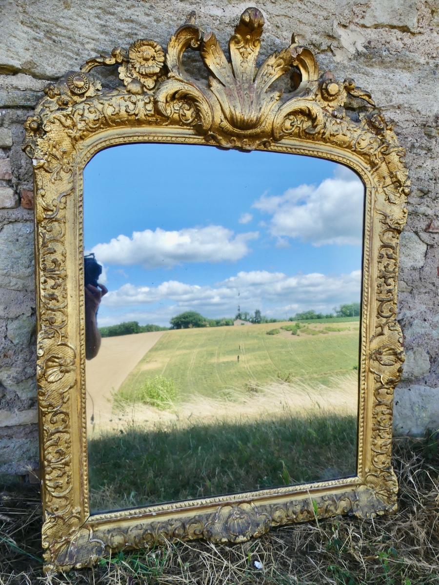 Miroir en bois sculpté et doré, Louis XIV/ Régence, début XVIII ème
