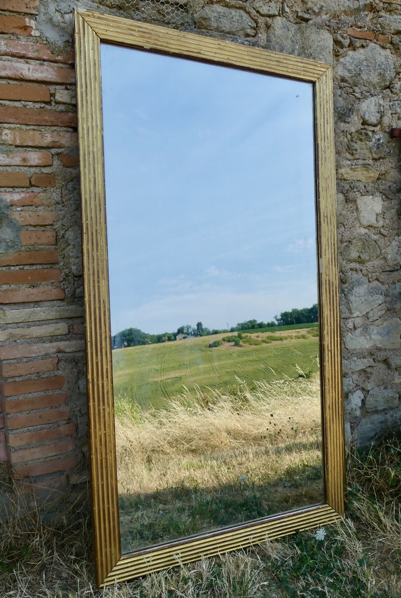Miroir en bois doré à cannelures, Louis XVI/ fin XVIII ème