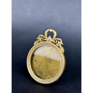 Petit cadre porte-photo en bronze doré de style Louis XVI                              2367,016