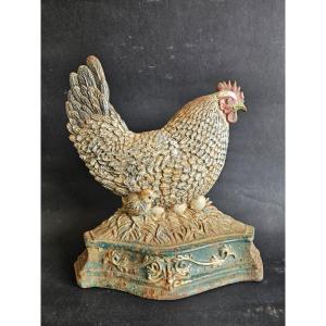 Cale porte poule en fonte