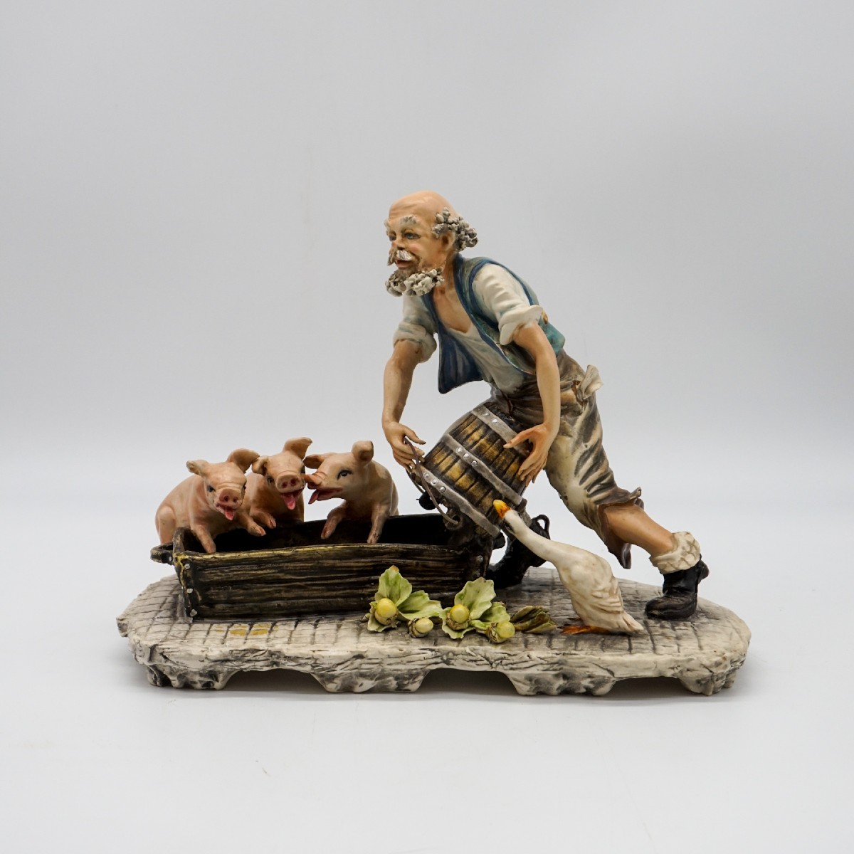 Sculpture Capodimonte « Éleveur de cochons » signée Mollica