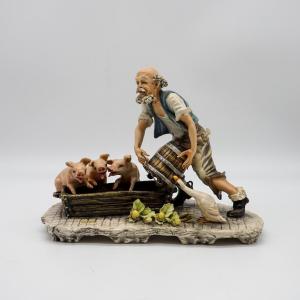 Sculpture Capodimonte « Éleveur de cochons » signée Mollica