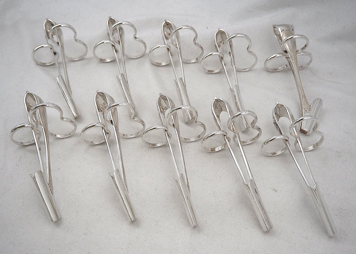 Christofle modèle Malmaison ancien, 10 pinces à asperges individuelles en métal argenté.