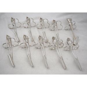 Christofle modèle Malmaison ancien, 10 pinces à asperges individuelles en métal argenté.