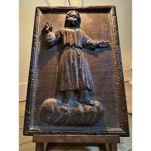 Sculpture XVIIIe en applique représentant un jeune saint ou un moine
