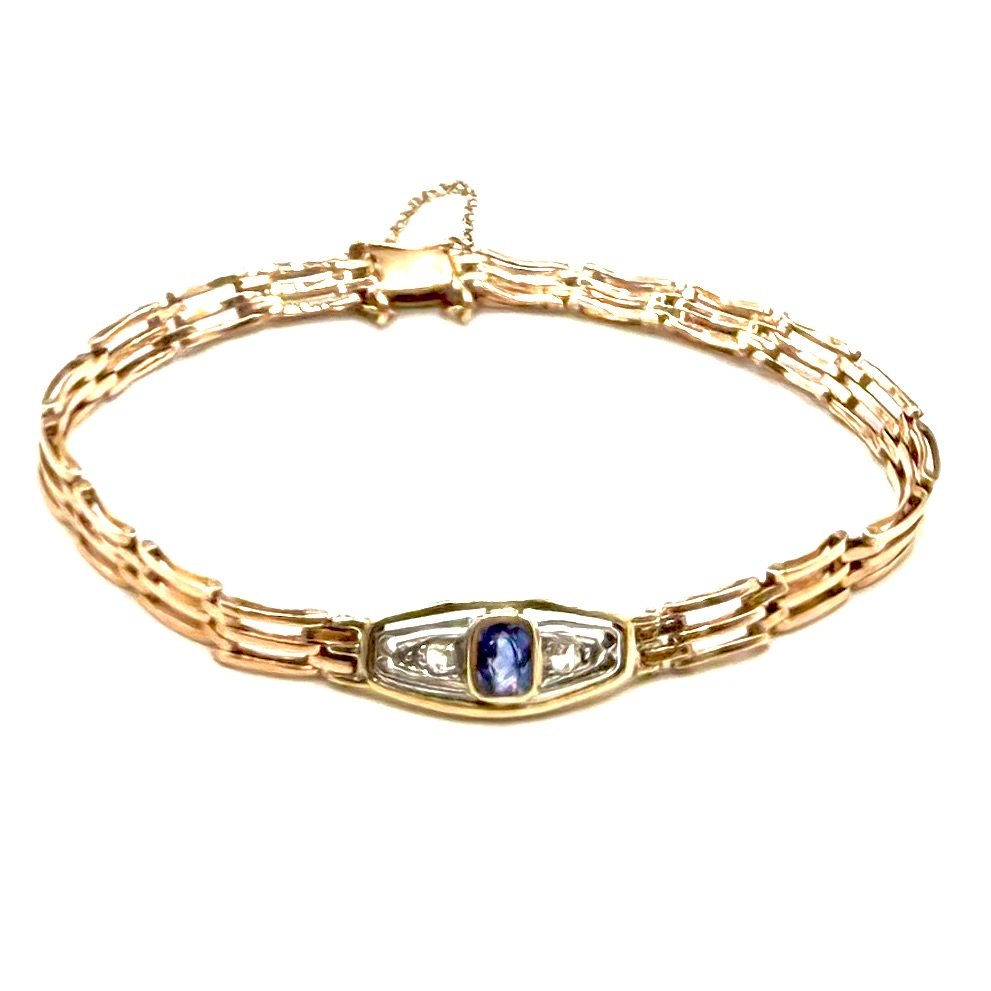 5152. Bracelet Art déco en or, orné d’un diamant et d’un saphir.