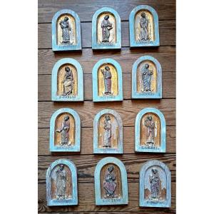 A Set Of Twelve Reliefs Of The Apostles, Carved From Wood, Polychromed, And Gilded, Late 19th–early 20th Century