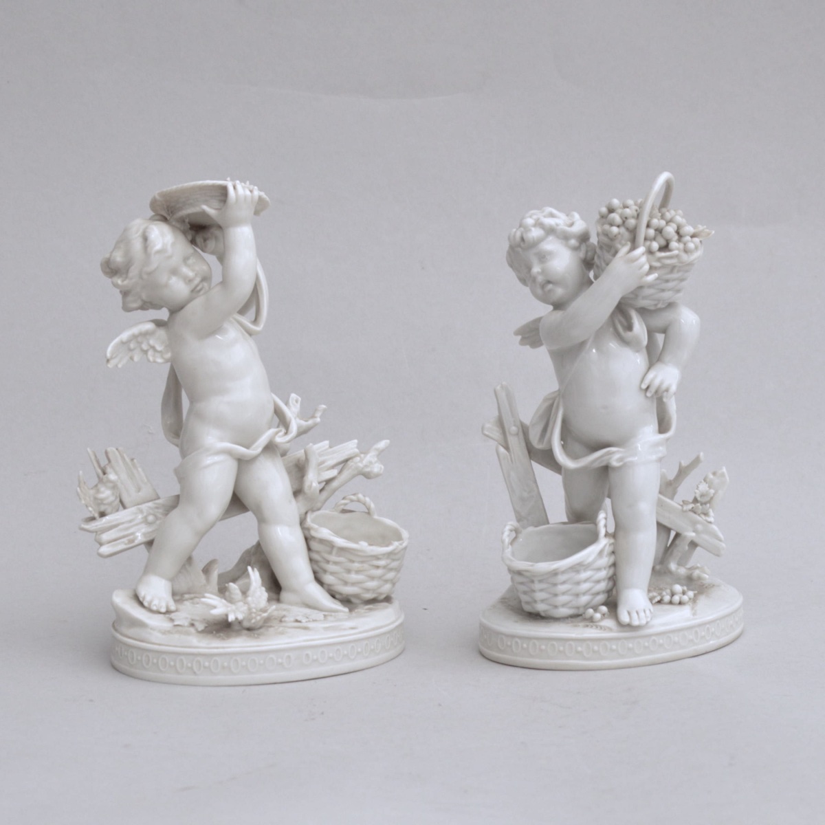Pair Of Porcelain Figures From Volkstedt—putti Harvesting Grapes, Circa 1900–1930