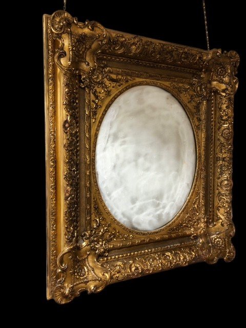 A Carved And Gilt Mirror-photo-1