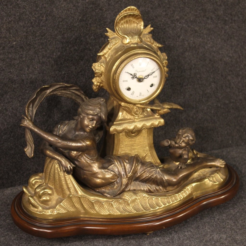 French Clock In Bronze And Gilded Antimony