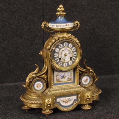 French Clock In Gilded Bronze And Brass With Painted Ceramic