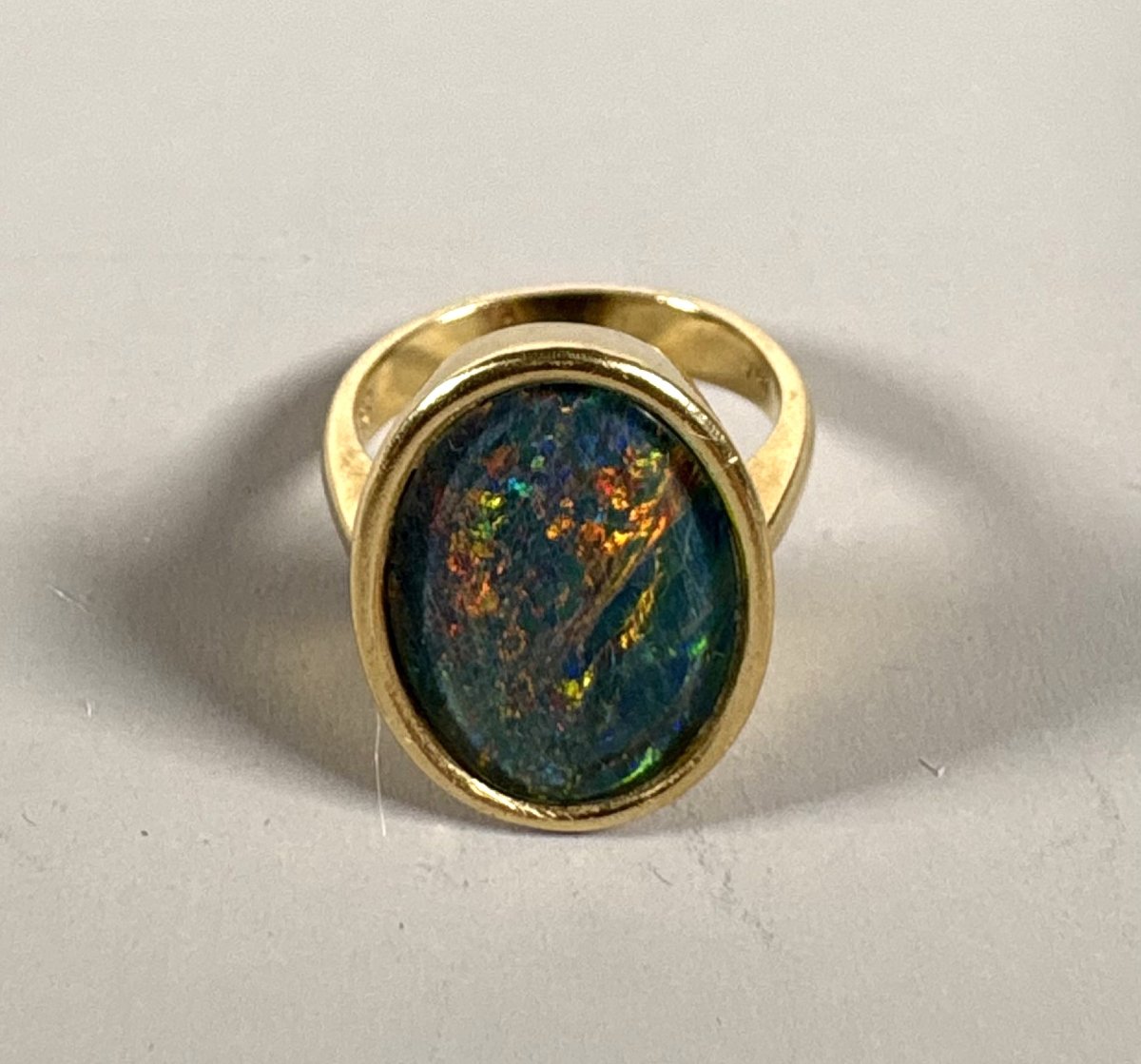 18k Yellow Gold Ring Set With A Large Dark Australian Opal