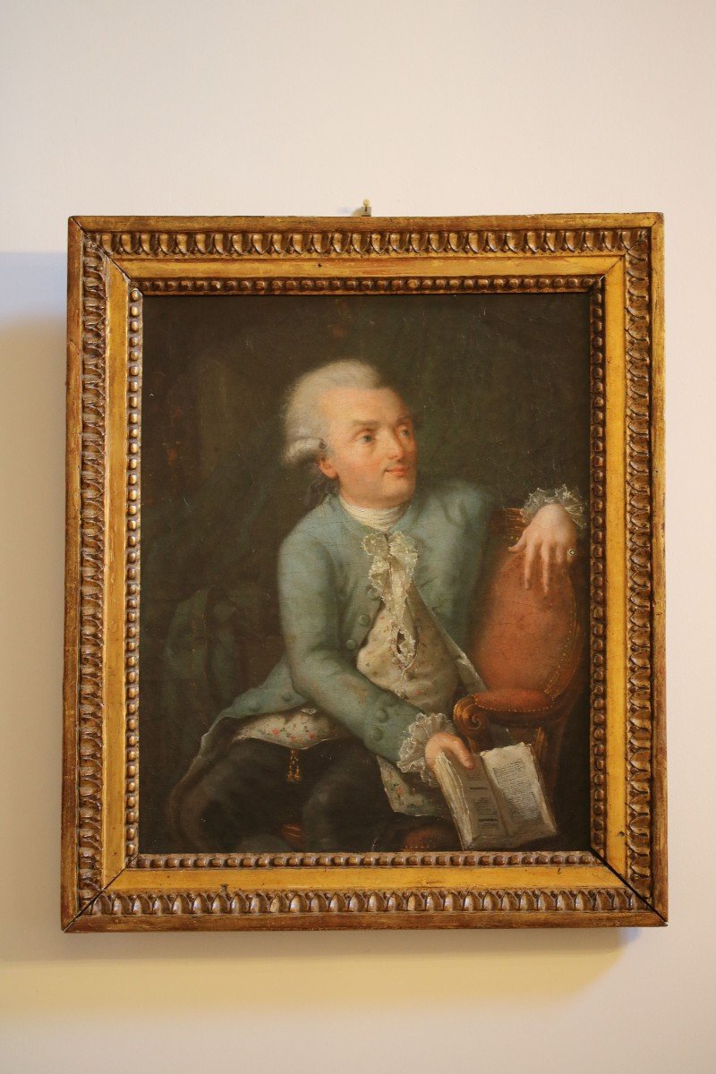 Portrait Of Man Sitting In His Library