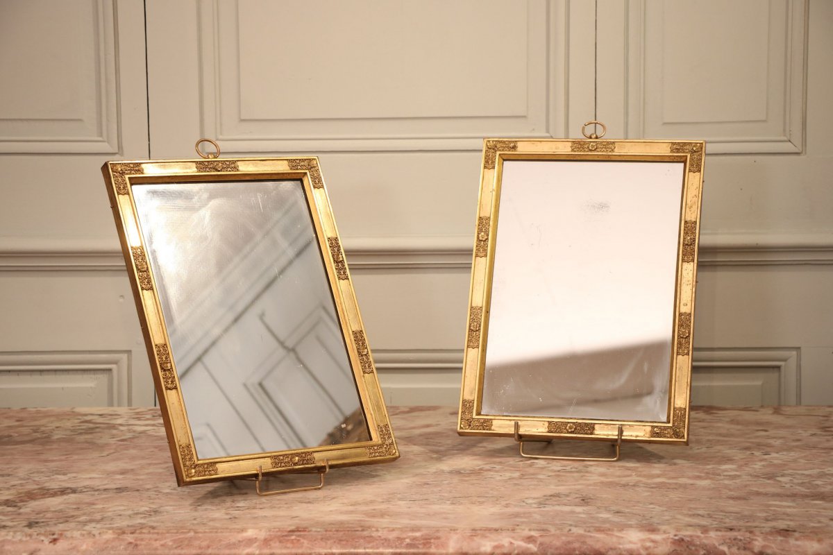 Pair Of Hanging Mirrors In Gilt Bronze