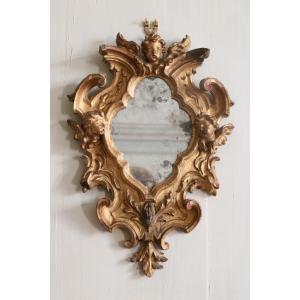 Miroir italien Louis XV en bois sculpté et doré